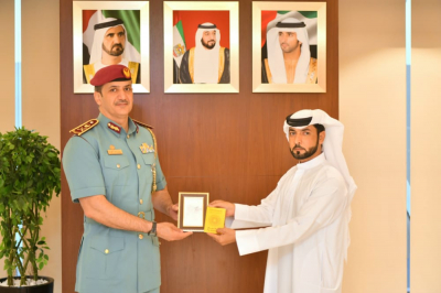 Maj. Gen. Jamal bin Aded honors the 1st corporal Eissa Al Falasi