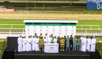 Brig. Gen. Rashid Khalifa Al Falasi honors the winner of the DCD race at the Dubai Racing Club evening