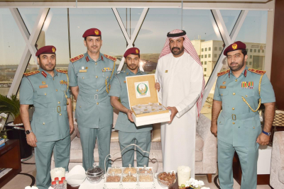In Participation of Almatrooshi and His Assistants DCD Distributes Flags, Badges to Mark Flag Day