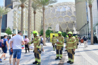 Dubai Civil Defense distributes UAE flags to Expo 2020 visitors
